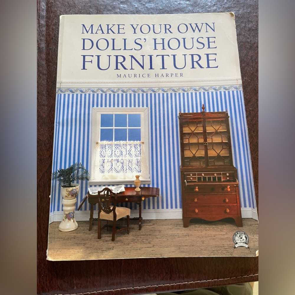 Paperback dolls house book. Very detailed.